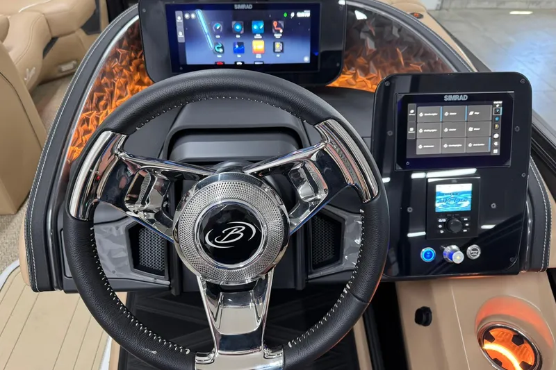 Slide: The Image of 2026 Barletta Lusso 23UCA dashboard with modern steering wheel and dual Simrad displays. - 21