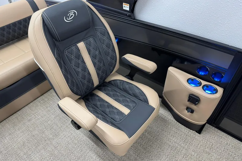 Slide: The Image of Luxurious Barletta Lusso 23UCA 2026 boat seat with elegant stitching and illuminated cup holders. - 24