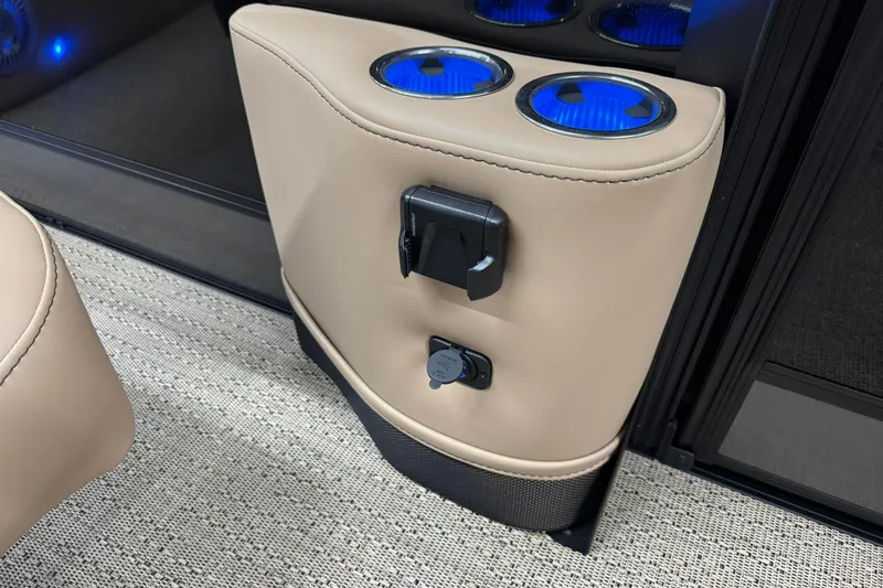 Slide: The Image of 2026 Barletta Lusso 23UCA interior with illuminated cup holders and charging ports. - 25