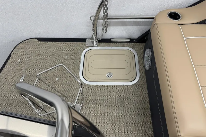 Slide: The Image of Barletta Lusso 23UCA 2026 boat interior with beige seating and floor hatch. - 35