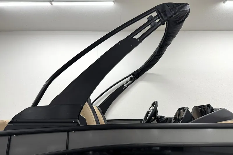 Slide: The Image of 2026 Barletta Lusso 23UCA boat interior with sleek black arch and modern dashboard. - 39