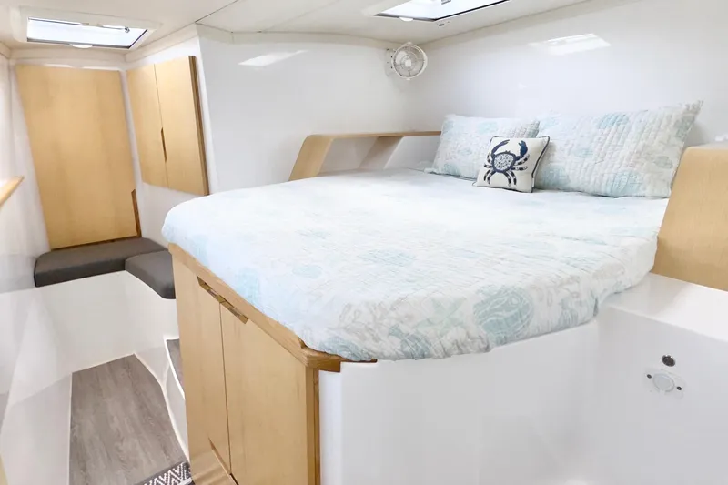 Slide: The Image of 2023 Seawind 1170 yacht interior with cozy bed and nautical decor. - 23