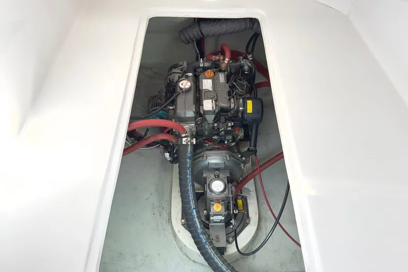 Slide: The Image of Engine compartment of 2023 Seawind 1170 catamaran, showcasing mechanical components and wiring. - 39