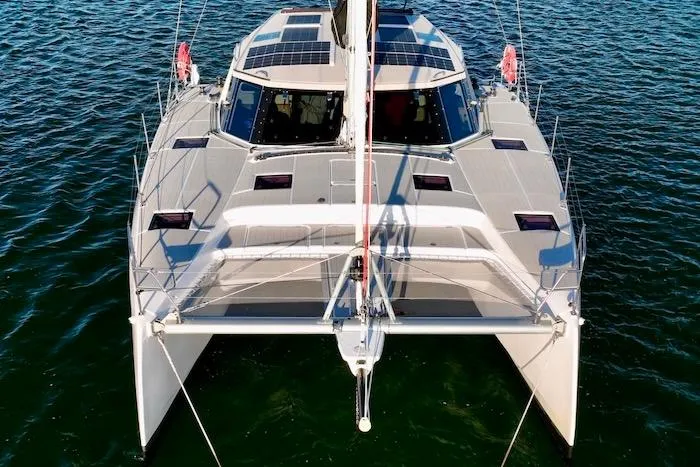 Slide: The Image of 2023 Seawind 1170 catamaran on water, featuring solar panels and sleek design. - 7