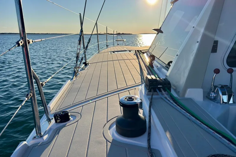 Slide: The Image of 2023 Seawind 1170 sailboat deck with ocean view at sunset. - 9