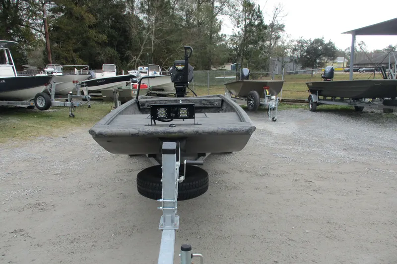 Slide: The Image of 2026 Gator Tail 1754 Extreme boat on trailer in outdoor lot. - 2