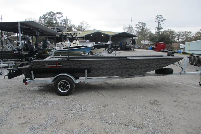 Slide: The Image of 2026 Gator Tail 1754 Extreme boat on trailer in outdoor setting. - 3