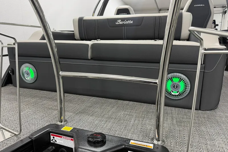 Slide: The Image of 2026 Barletta CORSA 25UC boat interior with sleek seating and illuminated speakers. - 13