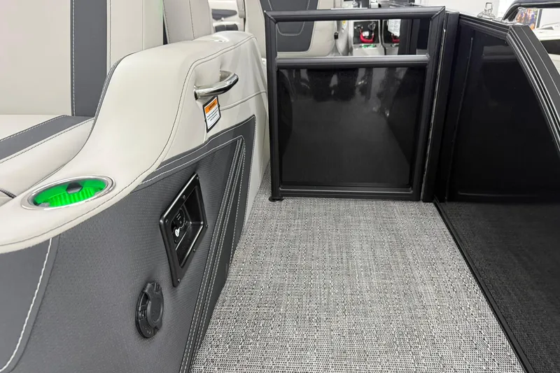 Slide: The Image of Interior of 2026 Barletta CORSA 25UC boat with modern seating and cup holder. - 21