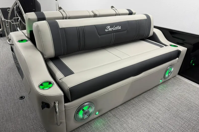 Slide: The Image of 2026 Barletta CORSA 25UC boat seating with integrated speakers and cup holders. - 22
