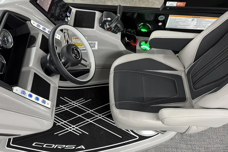Slide: The Image of Interior of 2026 Barletta CORSA 25UC boat, featuring modern steering and seating. - 26