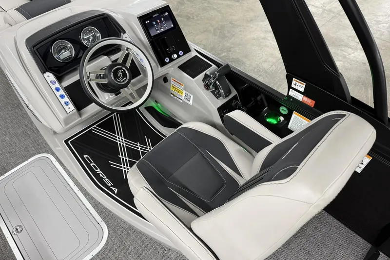 Slide: The Image of 2026 Barletta CORSA 25UC boat cockpit with modern steering and control panel. - 27