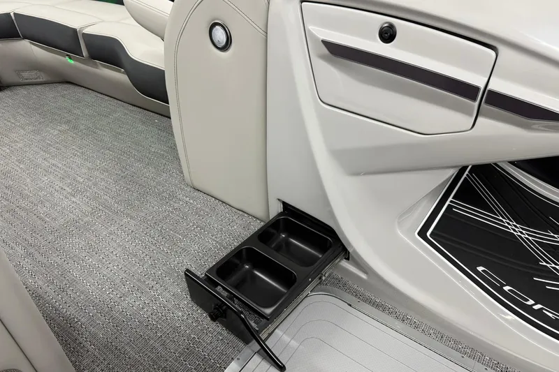 Slide: The Image of Interior of 2026 Barletta CORSA 25UC with cup holders and sleek seating design. - 35