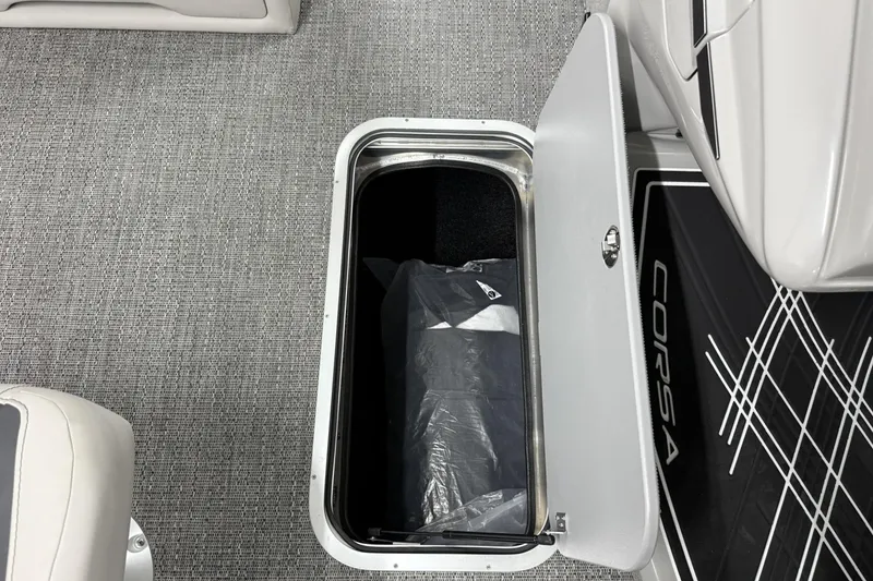 Slide: The Image of Open storage compartment in 2026 Barletta CORSA 25UC boat, featuring sleek interior design. - 37