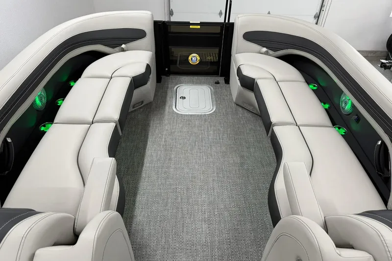 Slide: The Image of Luxurious interior of 2026 Barletta CORSA 25UC pontoon boat with plush seating and ambient lighting. - 38