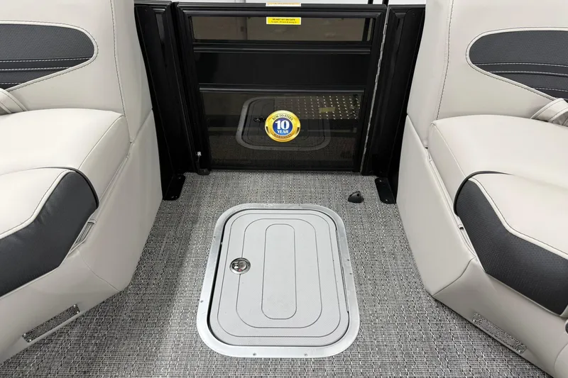 Slide: The Image of Interior of 2026 Barletta CORSA 25UC boat with seating and storage hatch. - 41