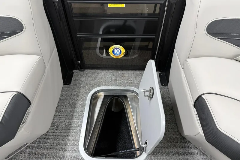 Slide: The Image of 2026 Barletta CORSA 25UC boat interior with open storage compartment and seating. - 42