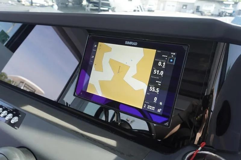 Slide: The Image of Simrad navigation display on 2025 Axopar 29 XC Cross Cabin boat dashboard. - 10