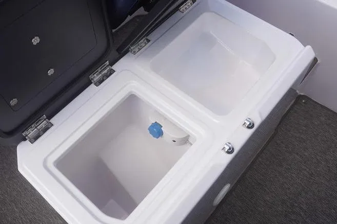 Slide: The Image of 2025 Axopar 29 XC Cross Cabin storage compartments, open and empty, showcasing interior design. - 7