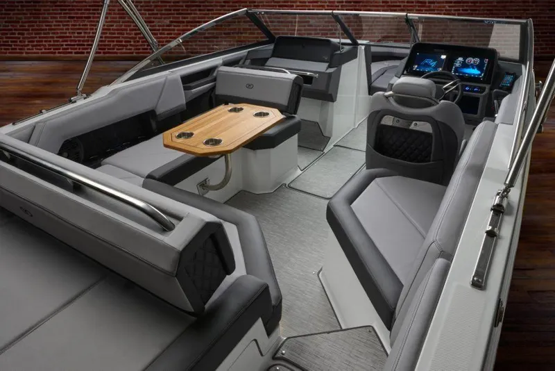 Slide: The Image of Manufacturer Provided Image: 2022 Cobalt R4 boat interior with modern seating and wooden table. - 15
