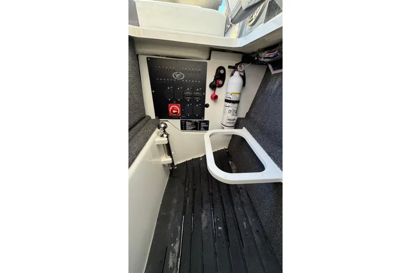 Slide: The Image of Interior of 2022 Cobalt R4 boat with control panel and fire extinguisher. - 8