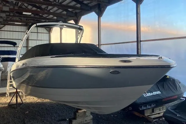 The Image of 2024 Monterey M-225 boat in storage, covered and elevated on blocks. - 0