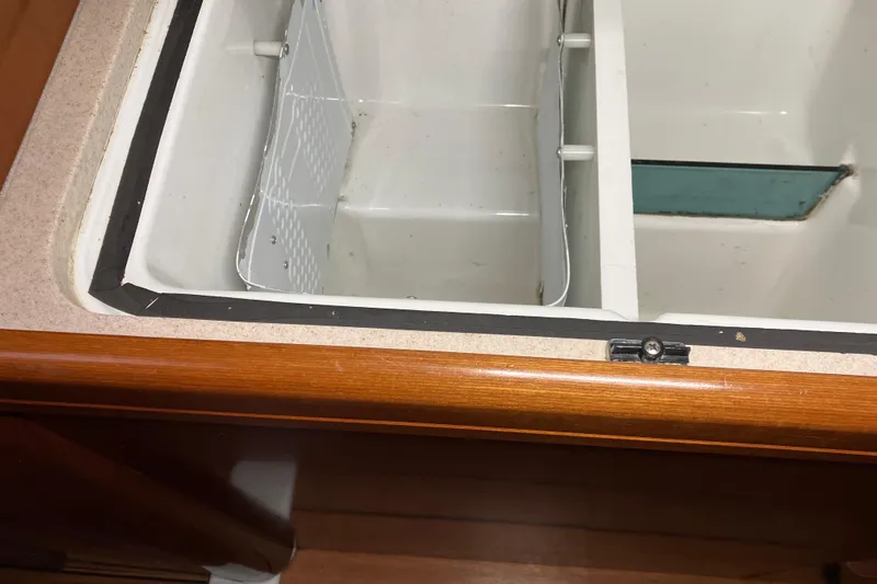 Slide: The Image of Interior view of a 2005 Beneteau Oceanis 423 yacht's storage compartment. - 9