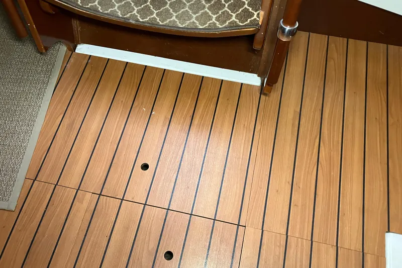 Slide: The Image of Wooden flooring on a 2005 Beneteau Oceanis 423 sailboat interior. - 39