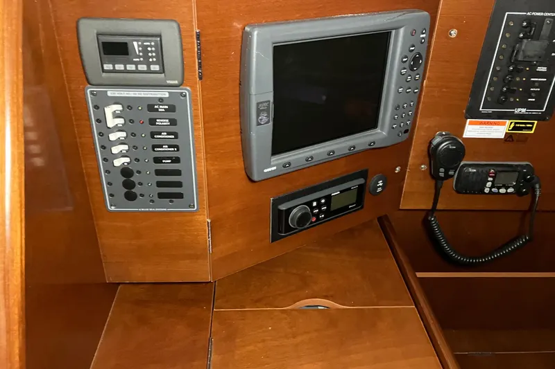 Slide: The Image of Control panel of a 2005 Beneteau Oceanis 423 sailboat with navigation equipment. - 21