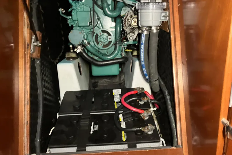 Slide: The Image of Engine compartment of 2005 Beneteau Oceanis 423 sailboat, featuring batteries and mechanical components. - 28