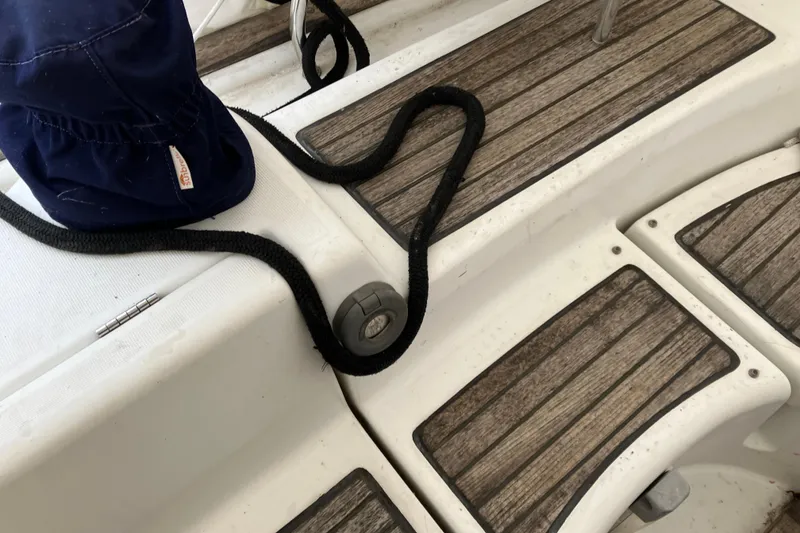 Slide: The Image of Deck of 2005 Beneteau Oceanis 423 sailboat with rope and wooden panels. - 44