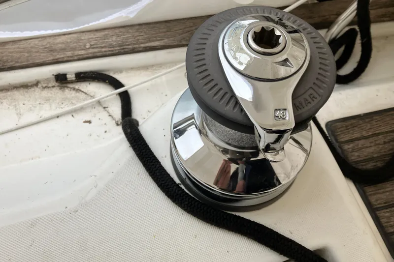 Slide: The Image of Winch on 2005 Beneteau Oceanis 423 sailboat deck with rope. - 43