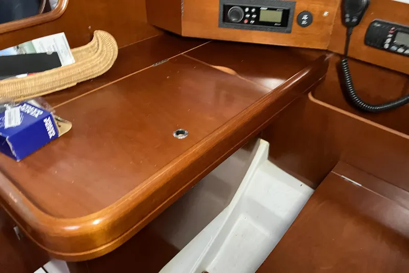 Slide: The Image of Interior of 2005 Beneteau Oceanis 423 yacht with wooden navigation desk and radio equipment. - 18