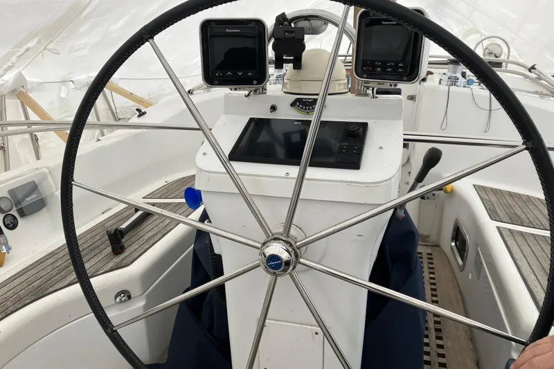 Slide: The Image of Steering wheel and navigation equipment on 2005 Beneteau Oceanis 423 sailboat. - 51