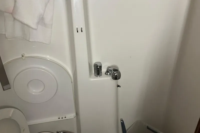 Slide: The Image of Bathroom interior of 2005 Beneteau Oceanis 423 yacht, featuring shower and toilet. - 14