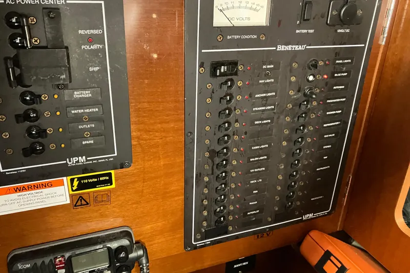 Slide: The Image of Electrical control panel on a 2005 Beneteau Oceanis 423 sailboat, featuring various switches and indicators. - 25