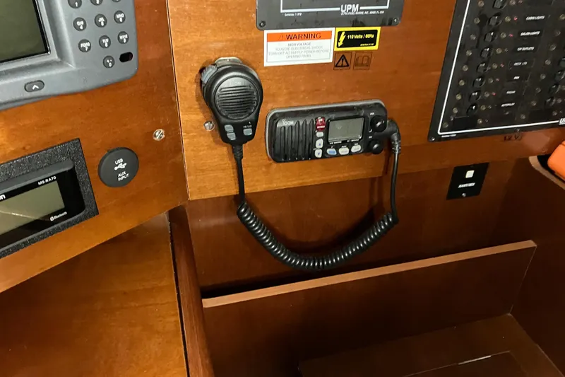 Slide: The Image of Control panel of a 2005 Beneteau Oceanis 423 sailboat with radio and navigation equipment. - 23