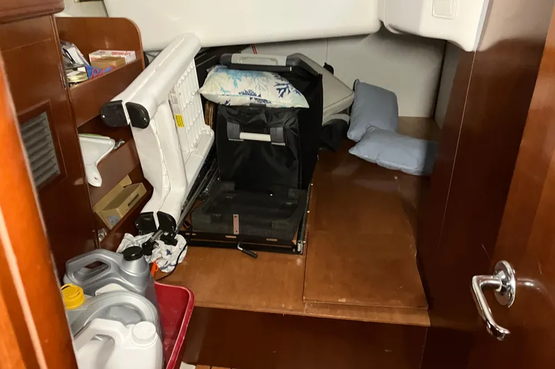 Slide: The Image of Interior cabin of 2005 Beneteau Oceanis 423 with storage and supplies. - 12