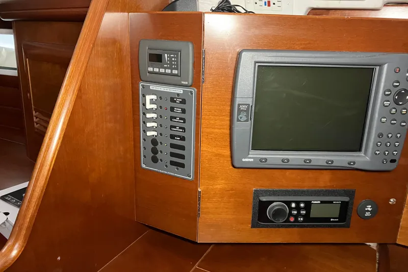 Slide: The Image of Control panel of a 2005 Beneteau Oceanis 423 sailboat with navigation equipment. - 24