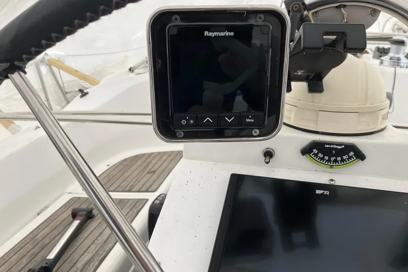 Slide: The Image of Cockpit of 2005 Beneteau Oceanis 423 with Raymarine navigation system and compass. - 49