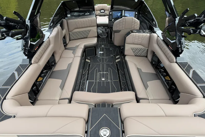 Slide: The Image of 2026 Centurion Ri245 boat interior with luxurious seating and modern design on the water. - 11