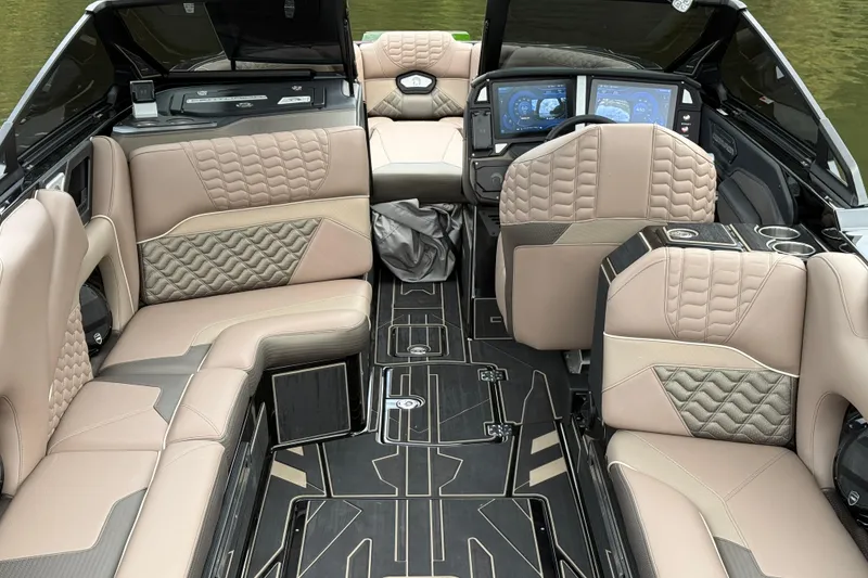 Slide: The Image of Luxurious interior of 2026 Centurion Ri245 boat with plush seating and advanced dashboard. - 12