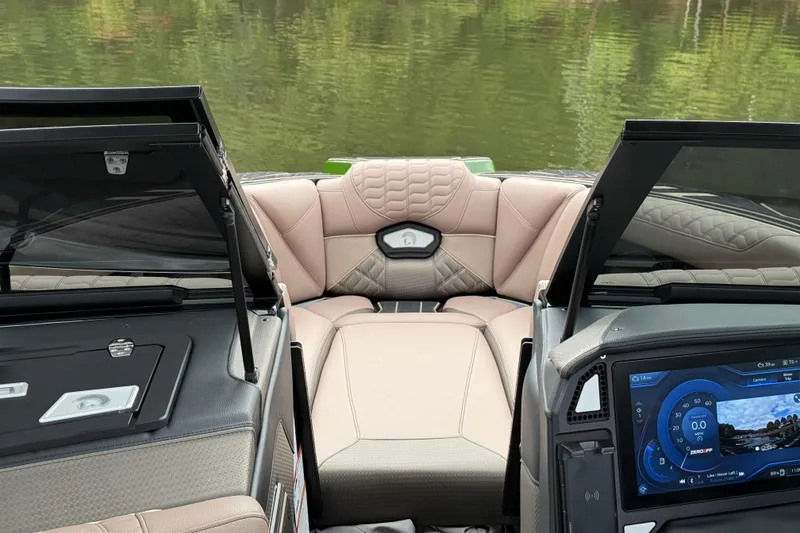 Slide: The Image of 2026 Centurion Ri245 boat interior with luxurious seating and advanced dashboard display. - 15