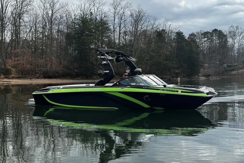 Slide: The Image of 2015 Centurion Enzo FS44 boat on calm lake with forested background. - 11