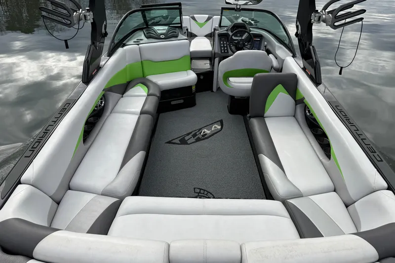 Slide: The Image of 2015 Centurion Enzo FS44 boat interior with green and gray seating, sleek design. - 17