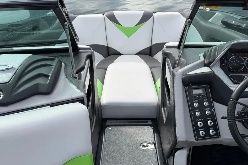 Slide: The Image of 2015 Centurion Enzo FS44 boat interior with modern dashboard and seating. - 18
