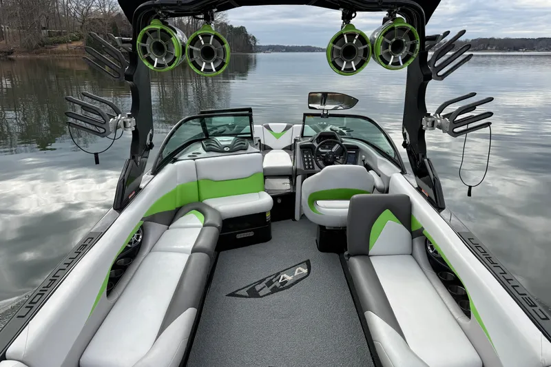Slide: The Image of 2015 Centurion Enzo FS44 boat interior with green accents on a calm lake. - 19