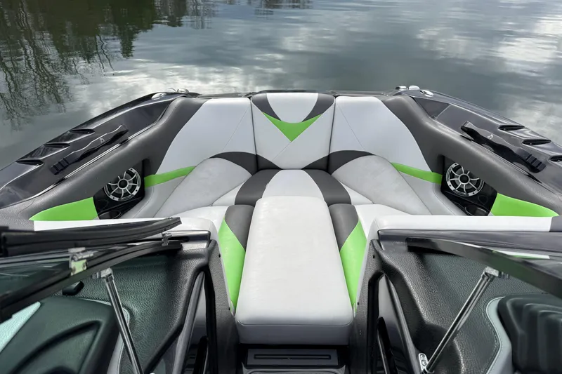 Slide: The Image of 2015 Centurion Enzo FS44 boat interior with green, white, and black seating. - 23