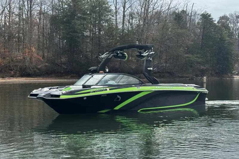 Slide: The Image of 2015 Centurion Enzo FS44 boat on calm lake with forested background. - 4
