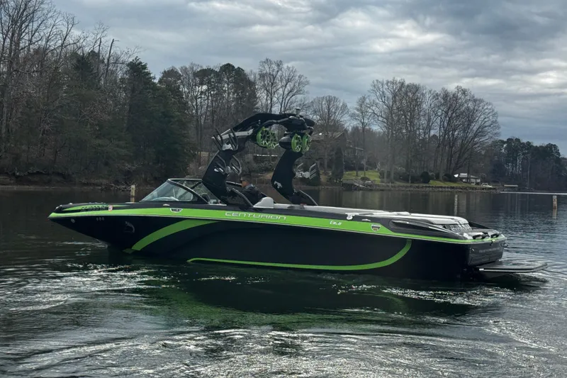Slide: The Image of 2015 Centurion Enzo FS44 boat on a calm lake with overcast skies. - 7